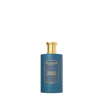 A blue Floris London bottle with a gold cap labeled "Hyacinth & Bluebell"—a green floral room fragrance inspired by fresh spring flowers.