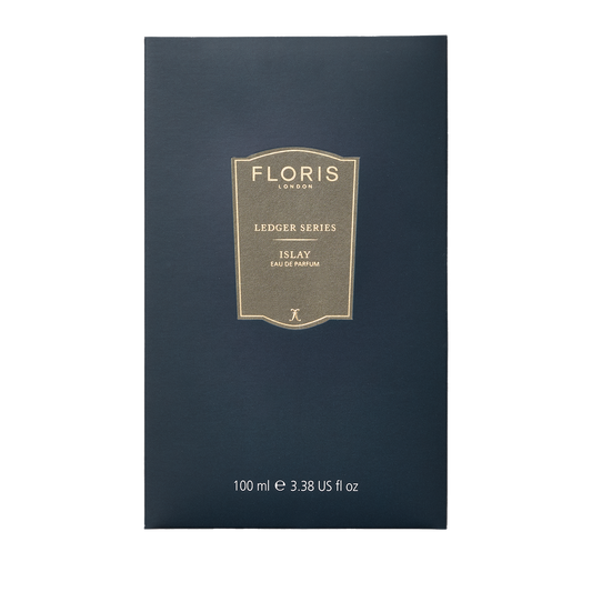 Dark blue Floris London Islay Eau de Parfum, 100ml, with gold label—Ledger Series fragrance inspired by Islay whisky’s peaty smoky scent.
