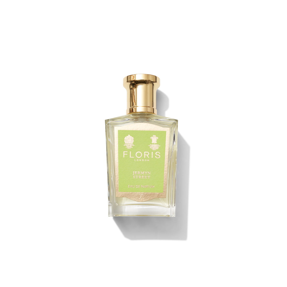 A glass bottle of Floris London Jermyn Street Eau de Parfum with a gold cap and a light green label.