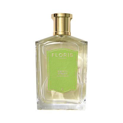 A clear glass bottle of Floris London Jermyn Street - Eau de Parfum with a gold cap and green label.