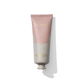 A tube of Floris London's Lily - Hand Treatment Cream, encased in minimalist packaging with soft pink and beige colors. This cream exudes an uplifting floral fragrance, leaving a lingering trail of elegance.