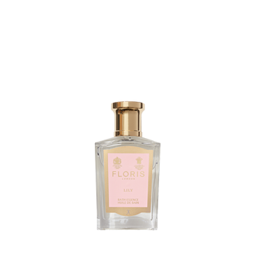 A clear glass bottle of Floris London Lily - Bath Essence with a gold cap, pink label, and a delicate lily scent.