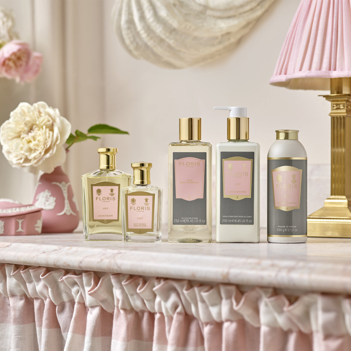 Floris London's Lily Eau de Toilette adorns the table, infused with Egyptian jasmine, pink roses, and luxurious fabric notes.