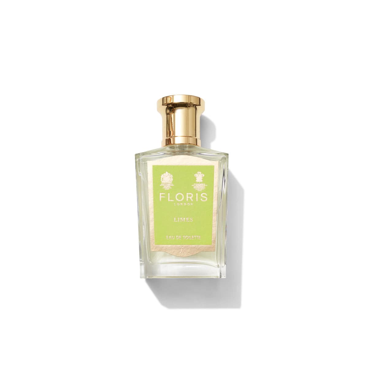 A bottle of Floris London Limes - Eau de Toilette with a gold cap and a light green label set against a white background, showcasing a vibrant citrus fragrance accented by hints of lemon zest.