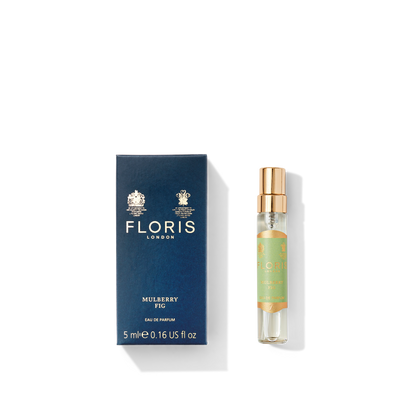 A blue Floris London Mulberry Fig - Eau de Parfum box sits next to a gold-capped spray bottle, showcasing a floral amber fragrance.