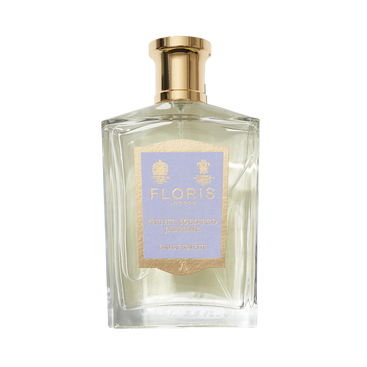 A clear glass bottle of Floris London Night Scented Jasmine Eau de Toilette, featuring notes of white jasmine and neroli blossom, topped with a gold cap.