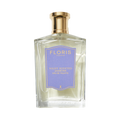 A clear glass bottle of Floris London Night Scented Jasmine Eau de Toilette, with a gold cap and purple label, blending neroli blossom and white jasmine.