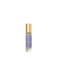 A small perfume bottle with a gold cap, featuring a lavender label that reads "Floris London," evokes Night Scented Jasmine under glowing lanterns.