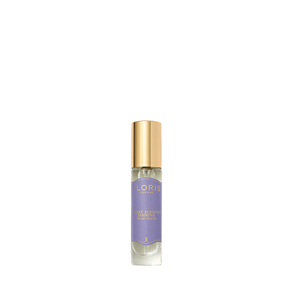 A Floris London Night Scented Jasmine Eau de Toilette with a gold cap and purple label, inspired by jasmine and neroli, sits on a white background.