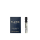 A sample vial of Floris London Night Scented Jasmine Eau de Toilette, featuring white jasmine and neroli blossom, lies next to its dark blue box.