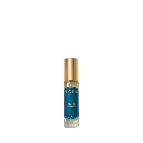 A small glass bottle with a gold cap and blue label, Floris London Neroli Voyage Eau de Parfum blends citrus notes with a fresh marine scent.