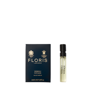 A Floris London Neroli Voyage - Eau de Parfum sample vial beside its blue box, featuring an elegant neroli scent with citrus and fresh marine notes.