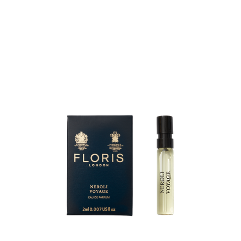 A Floris London Neroli Voyage - Eau de Parfum sample vial beside its blue box, featuring an elegant neroli scent with citrus and fresh marine notes.