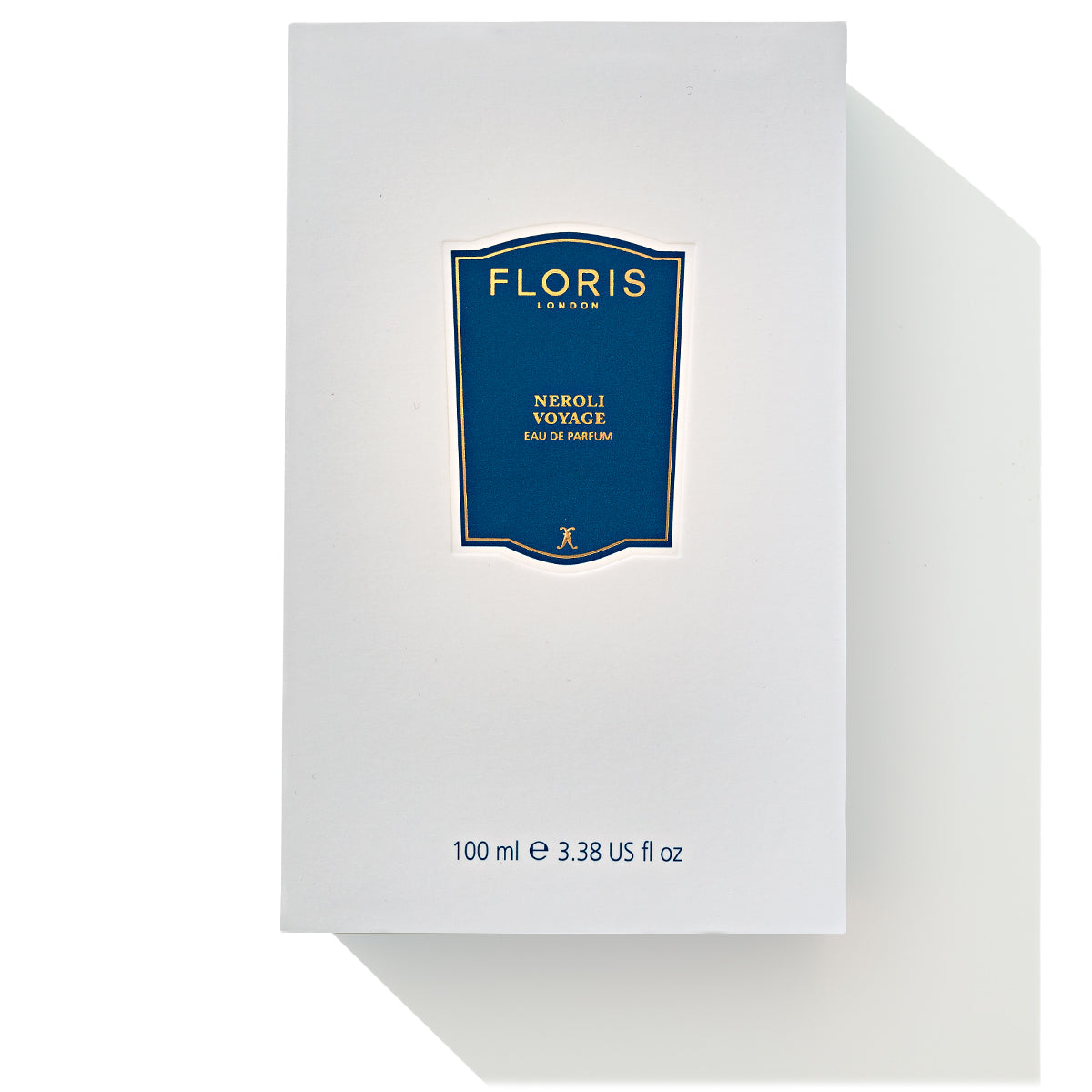 A white box with a blue label at the center reads "Floris London, Neroli Voyage - Eau de Parfum." This 100 ml (3.38 fl oz) bottle contains a luxurious unisex fragrance that embodies a citrus marine essence.