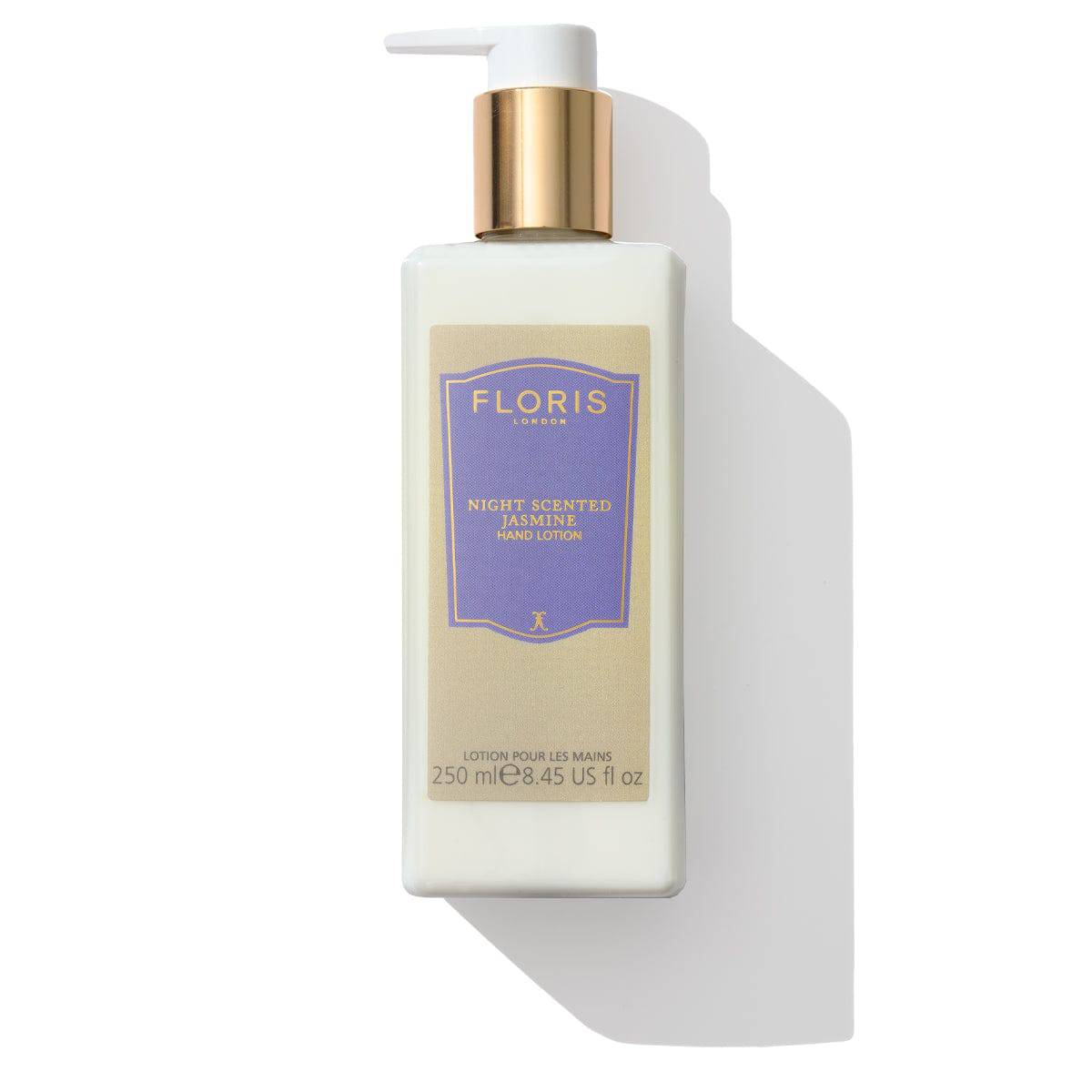 A 250ml bottle of Floris London Night Scented Jasmine Luxury Hand Lotion, featuring a pump dispenser and gold cap, enriched with sweet almond oil to soothe dry skin.