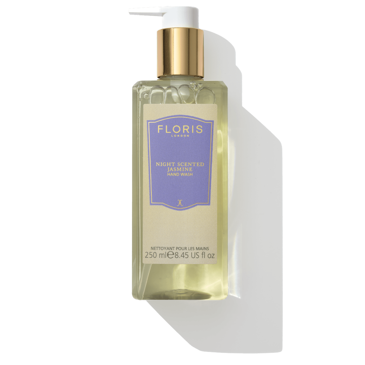 Clear rectangular bottle of Floris London Night Scented Jasmine - Luxury Hand Wash with a gold pump and purple label on a white background, designed to gently cleanse your hands.