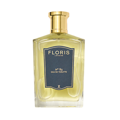 Clear glass bottle of Floris London No. 89 Eau de Toilette, featuring a gold cap and navy blue label—an iconic English fragrance for gentlemen.