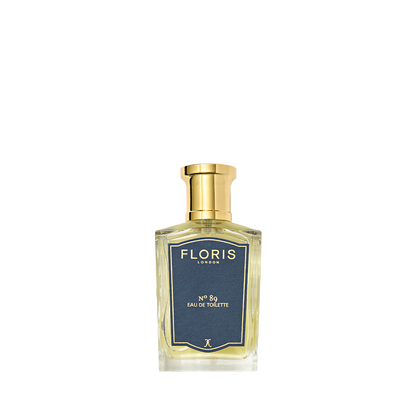 A clear glass bottle of Floris London No. 89 Eau de Toilette, featuring a gold cap and classic blue label.