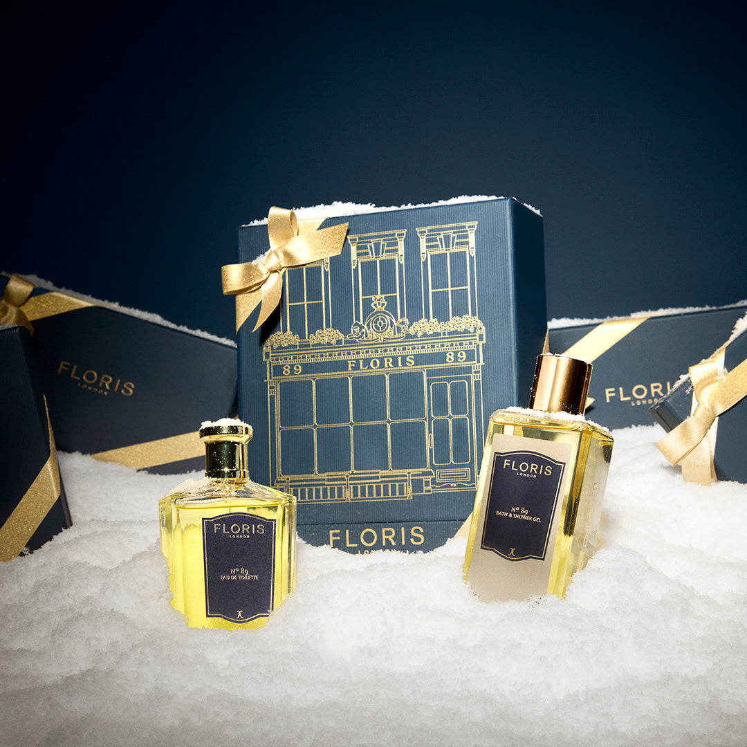 The Icon | No. 89 Duo by Floris London US—two perfume bottles with blue and gold gift boxes displayed on artificial snow.