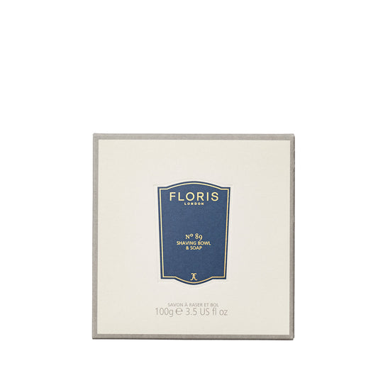 A 100g beige Floris London No. 89 Shaving Soap with shea butter, labeled in blue, perfect for refilling your wooden shaving bowl.