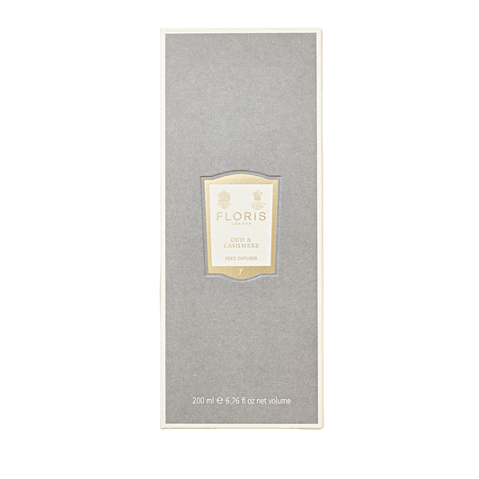 The Floris London Oud & Cashmere Reed Diffuser, 200 ml, features a stylish grey box with a cream label—an elegant way to elevate any room.