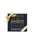 Dark blue Perfumer’s Trilogy: For Him gift box with a gold ribbon and a gold storefront illustration.