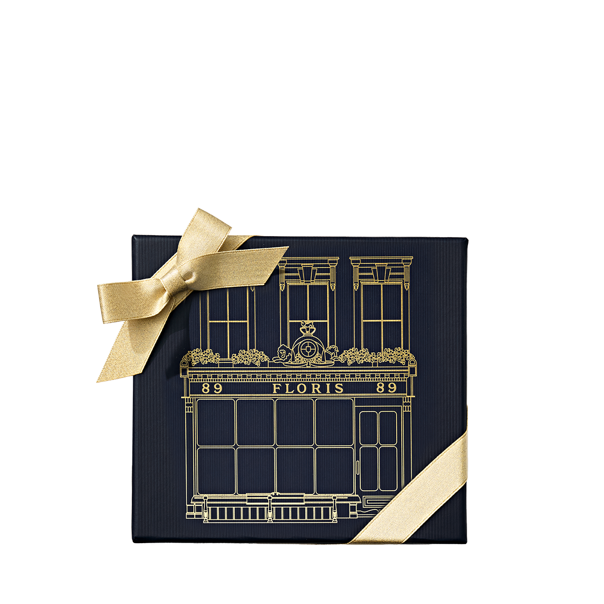 Dark blue Perfumer’s Trilogy: For Him gift box with a gold ribbon and a gold storefront illustration.