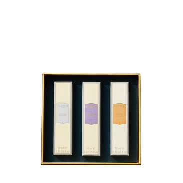 Floris London US Perfumer's Trilogy: For Her—three rectangular perfumes in a gold-edged box, each with a unique pastel label.