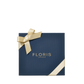 Floris London US Perfumer’s Trilogy: For Her gift box in navy blue, topped with a gold ribbon and bow, displayed on a white background.