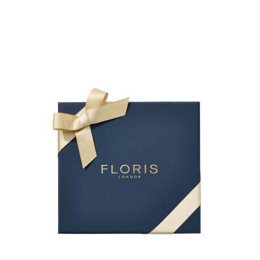 Square navy gift box with gold “Floris London” text and ribbon—ideal for gifting Perfumer’s Trilogy: For Her by Floris London on any special occasion.