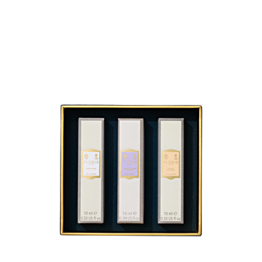 The Perfumer's Trilogy: For Her by Floris London includes three floral scents in rectangular white boxes with elegant gold trim.
