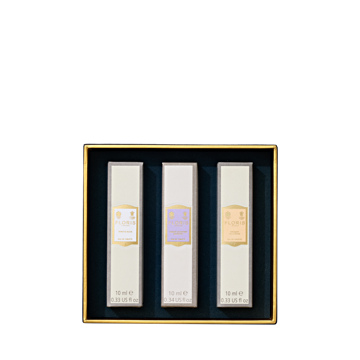 The Perfumer's Trilogy: For Her by Floris London includes three floral scents in rectangular white boxes with elegant gold trim.