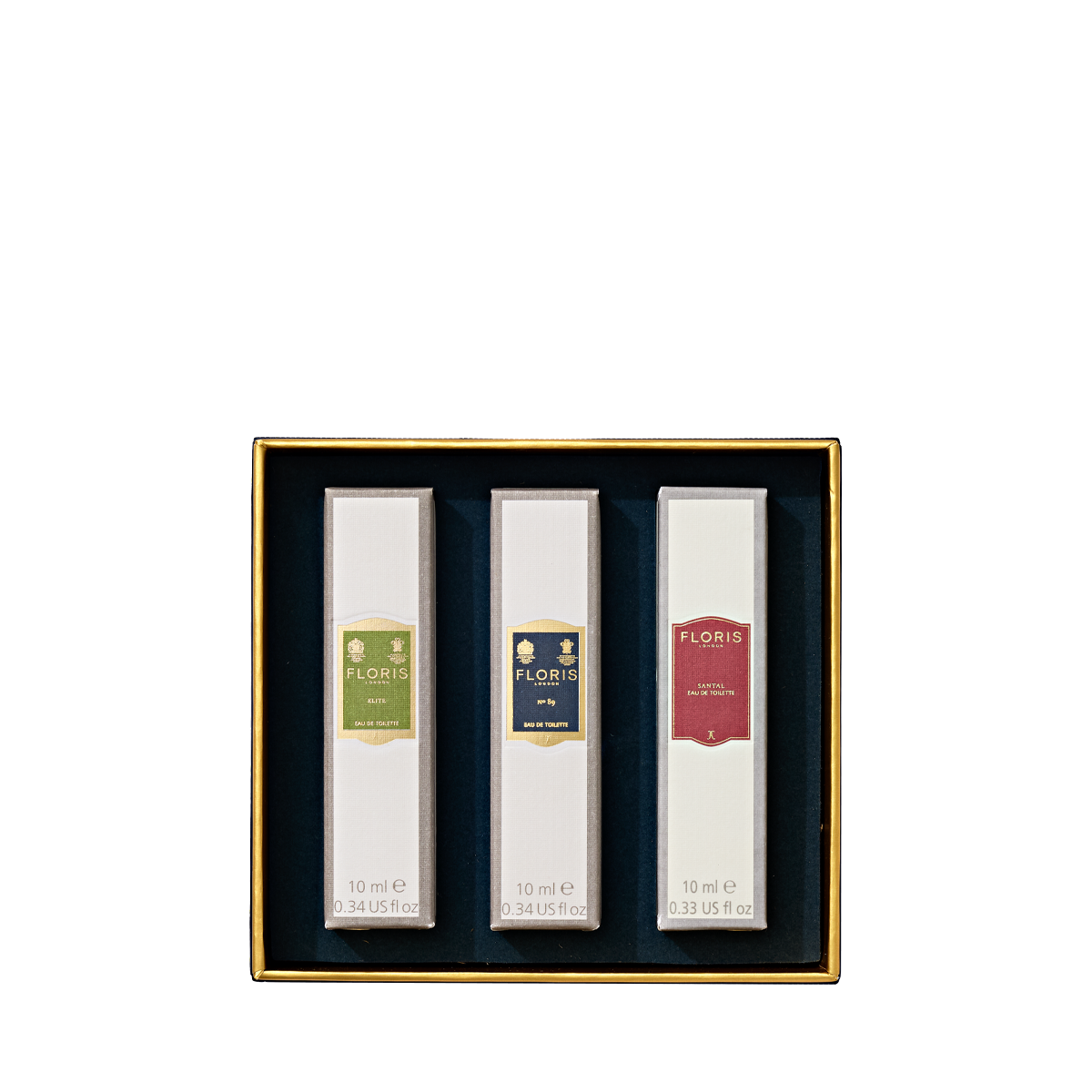 Floris London's Perfumer's Trilogy: For Him gift box features three men's fragrances, elegantly displayed against a dark blue background.