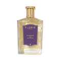 A clear glass bottle of Platinum 22 - Eau de Parfum by Floris London, featuring a gold cap and purple label—an elegant vegan fragrance.