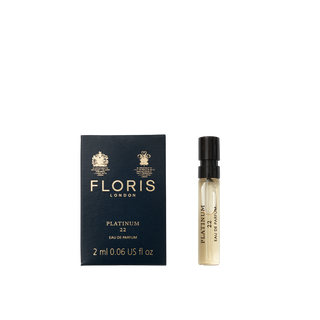 A 2 ml vegan sample vial of Floris London Platinum 22 - Eau de Parfum sits next to its dark blue box.