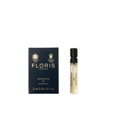 A 2 ml vegan sample vial of Floris London Platinum 22 - Eau de Parfum sits next to its dark blue box.