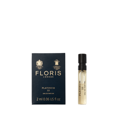 A 2 ml vegan sample vial of Floris London Platinum 22 - Eau de Parfum sits next to its dark blue box.
