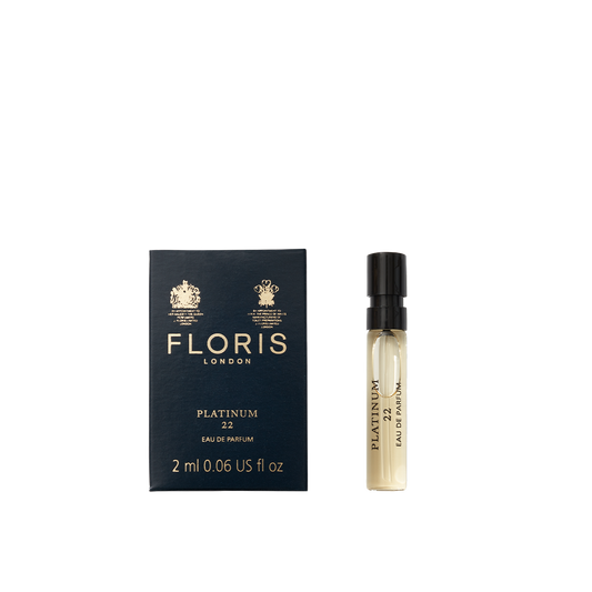 A 2 ml vegan sample vial of Floris London Platinum 22 - Eau de Parfum sits next to its dark blue box.