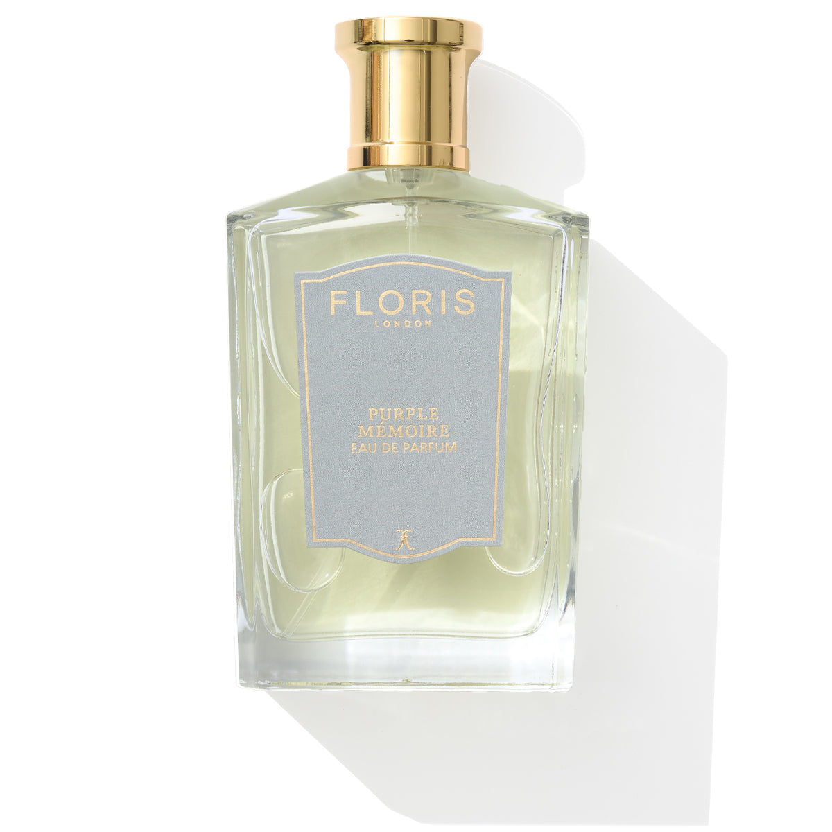 Purple Mémoire Eau de Parfum by Floris London: An English charm, in a glass bottle with a gold cap and lavender label.