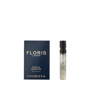 A 2ml Floris London Purple Mémoire - Eau de Parfum vial rests beside its dark blue box—a refined scent evoking classic English elegance.