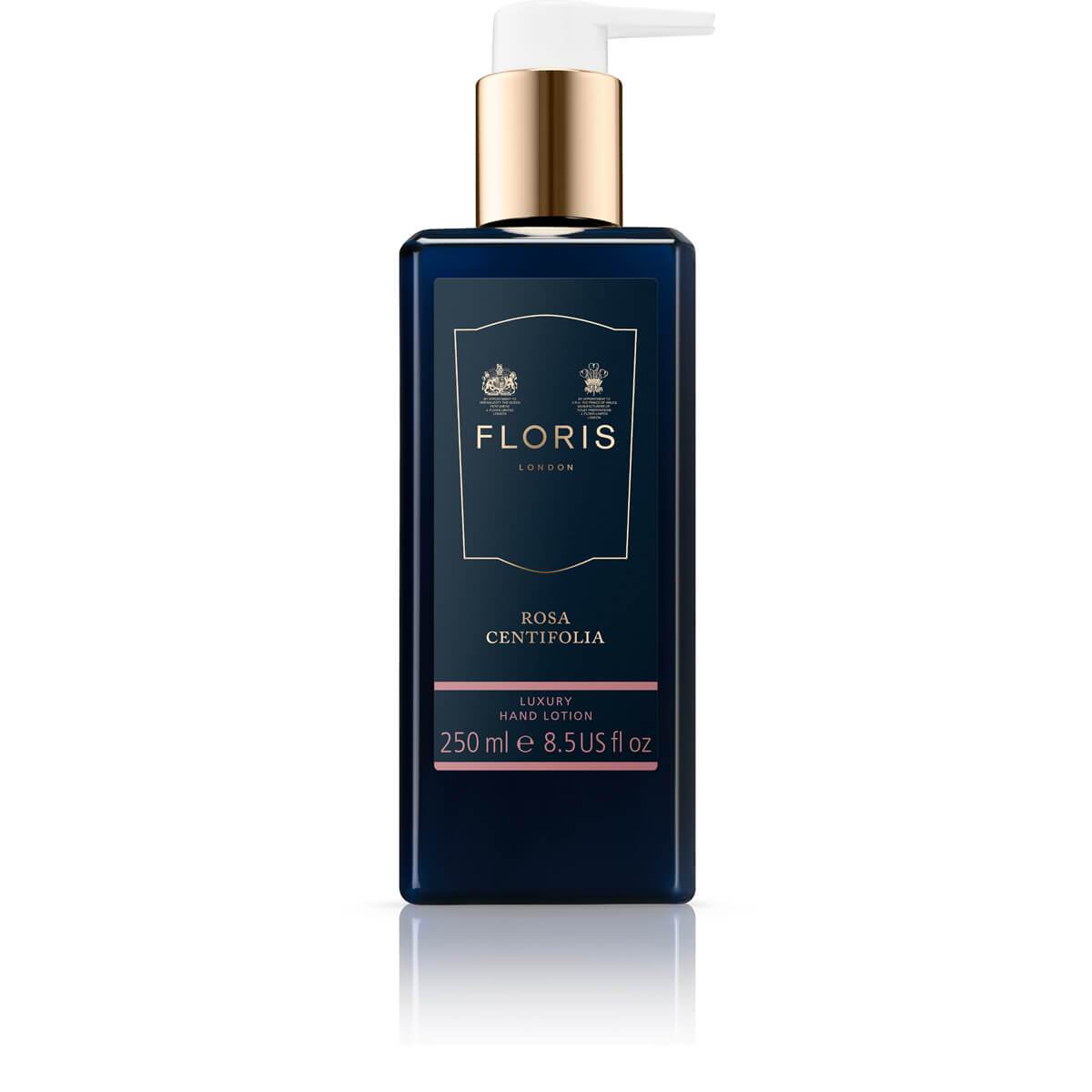 Navy 250ml bottle of vegan Floris London Rosa Centifolia luxury floral-scented hand lotion with a white pump, enriched with natural oils.