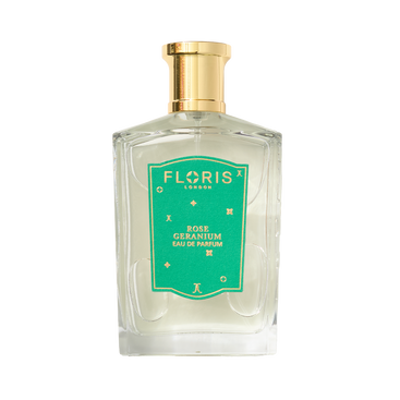 Clear glass perfume bottle with a gold cap and a green label reading "Rose Geranium | Limited Edition" by Floris London US.