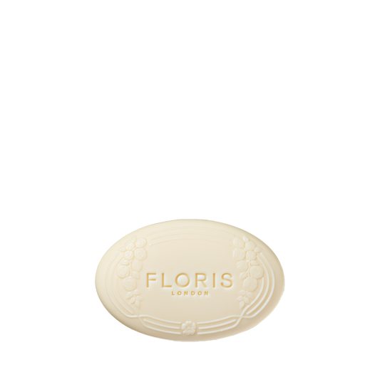 Oval bar of Rose Geranium - Luxury Soap by Floris London, featuring a floral border and vegetable base, embossed with the brand name on white.