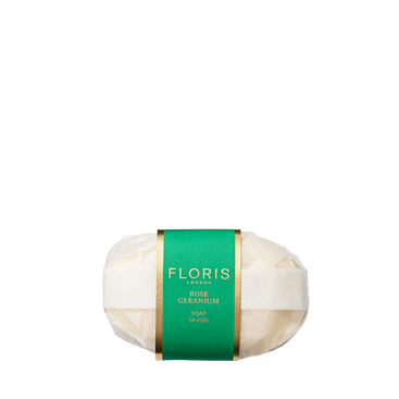 Floris London Rose Geranium - Luxury Soap is wrapped in white paper with a green and gold label and has a delicate floral scent.