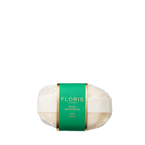 Floris London Rose Geranium - Luxury Soap is wrapped in white paper with a green and gold label and has a delicate floral scent.