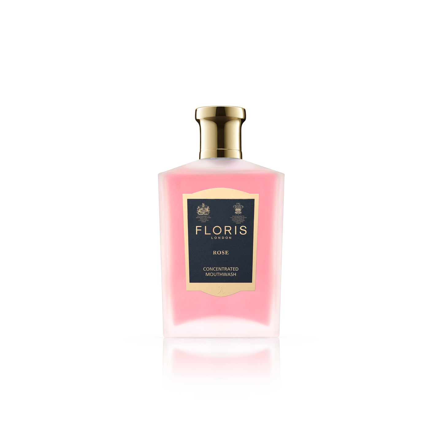 A bottle of Floris London Rose Mouthwash showcases a pink floral-flavored liquid complemented by a gold cap.