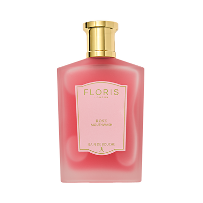 A pink Floris London Rose Mouthwash bottle with a gold cap and a pink-and-gold label.