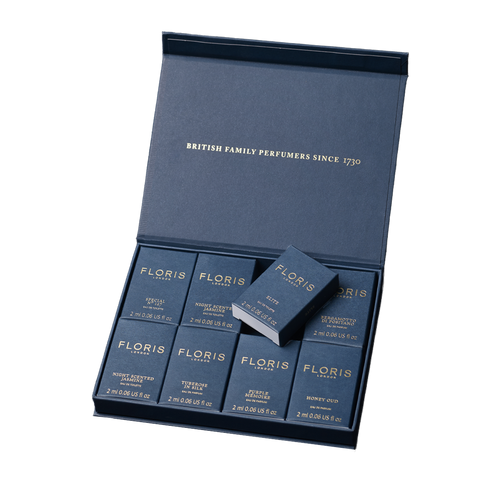 A blue Floris London UK Sample Set box contains eight neatly arranged 2ml fragrance bottles.