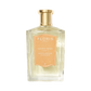 A clear glass bottle of Floris London Sandalwood with a gold cap and orange label, offering a timeless woody fragrance.