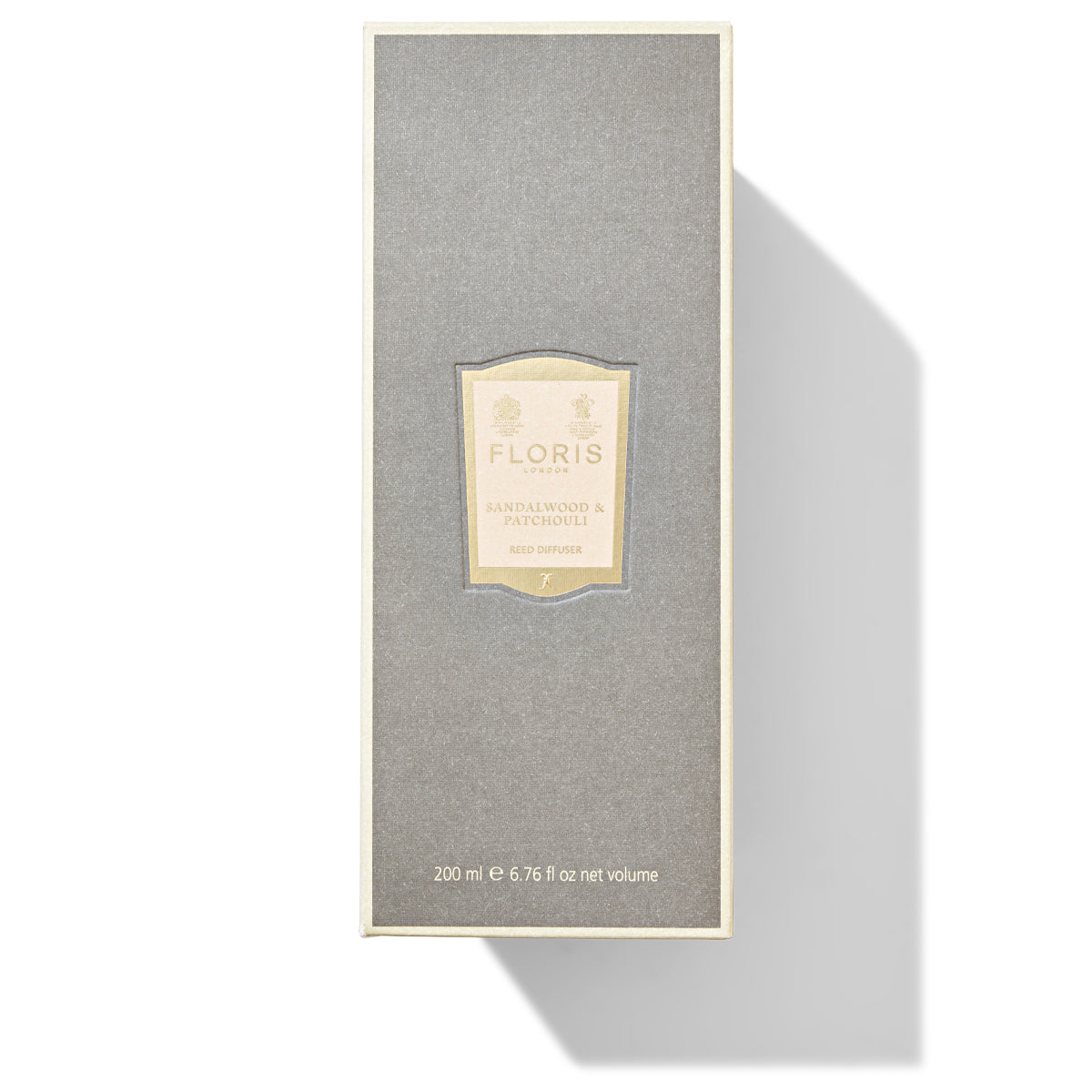 A Floris London Sandalwood & Patchouli Reed Diffuser box featuring a gray and beige design contains 200ml of product enriched with the soothing notes of woody amber.